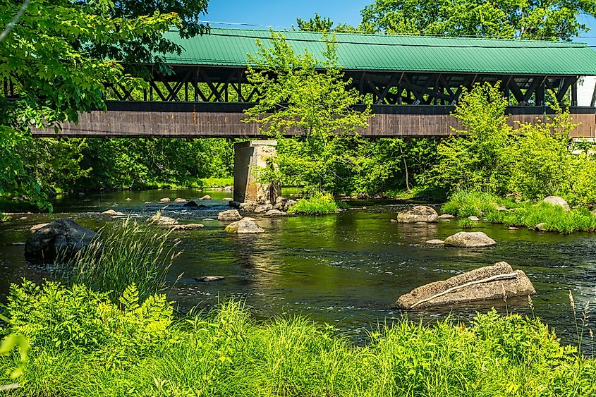 Rowell Covered Bridge is a covered bridge in Hopkinton, New Hampshire which carries Rowell Bridge Road over the Contoocook River. It is a long truss style bridge.