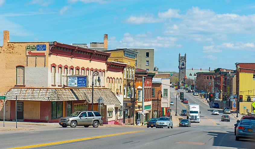 Historic sandstone and brick commercial buildings with Italianate style on Main Street in downtown Malone, Upstate New York