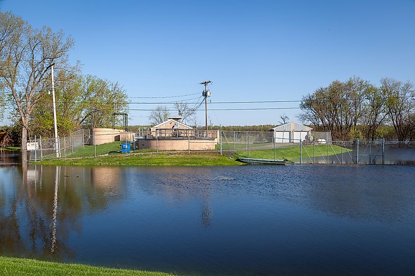 Moline, Illinois, USA. April 24 2023. Wastewater treatment plant surrounded by flood water.