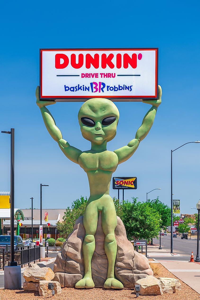 ROSWELL, NEW MEXICO, USA - JUNE 23, 2019: Dunkin' and Baskin Robbins sign being upheld by a green space alien.