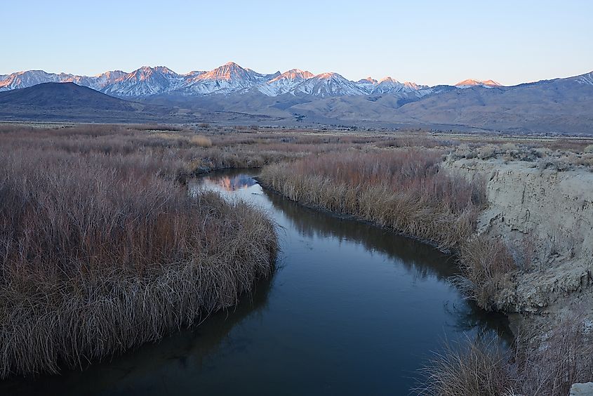 River bend with mountain peaks of Sierra Nevada mountain range near Big Pine, California.