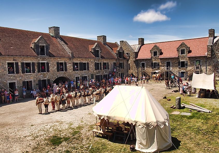 Inside Fort Ticonderoga on the shores of Lake Champlain in summertime, re-enactors performing for visitors