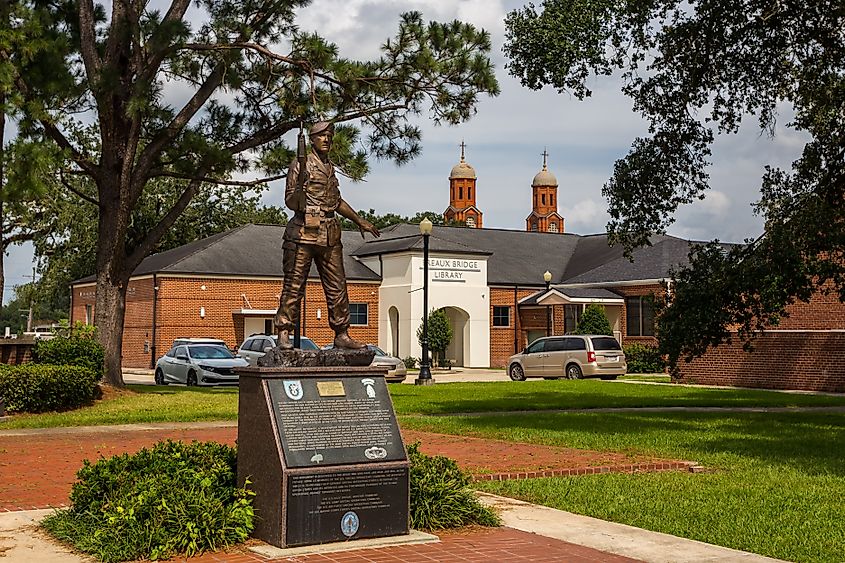 Statue near public library building, installed in honor of the Green Berets, in Breaux Bridge, Louisiana.