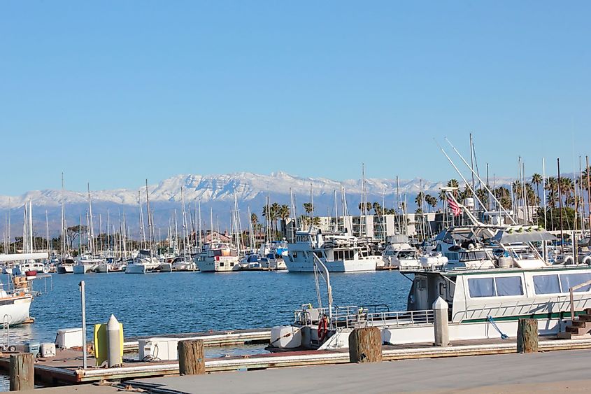 Channel Islands Harbor after a snow storm in the surrounding mountains