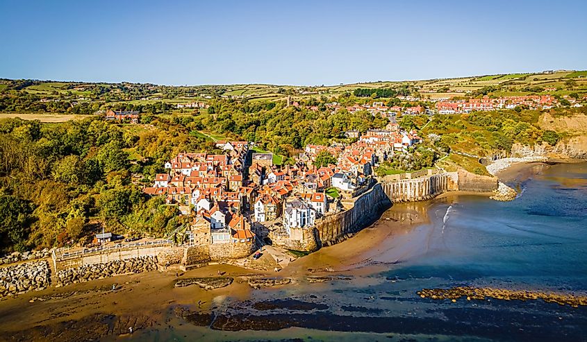 A view of Robin Hood's Bay, a picturesque old fishing village with rolling, lush green hills