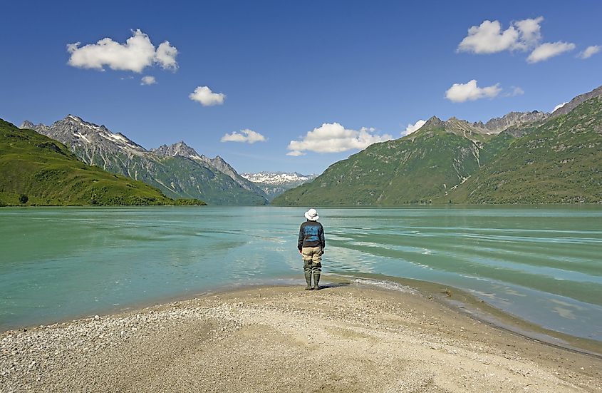 Person looking out over Crescent Lake at Lake Clark National Park.