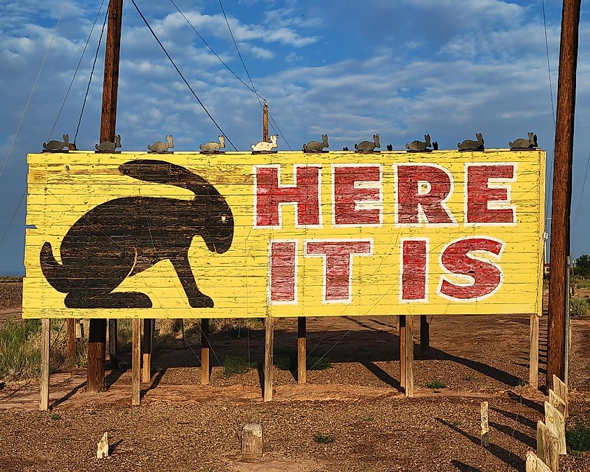 As you drive the historic Route 66 you see signs detailing the distance until you reach the Jackrabbit Trading Post. Here, you have arrived.