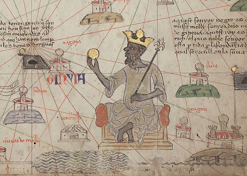Detail showing Mansa Musa sitting on a throne and holding a gold coin.