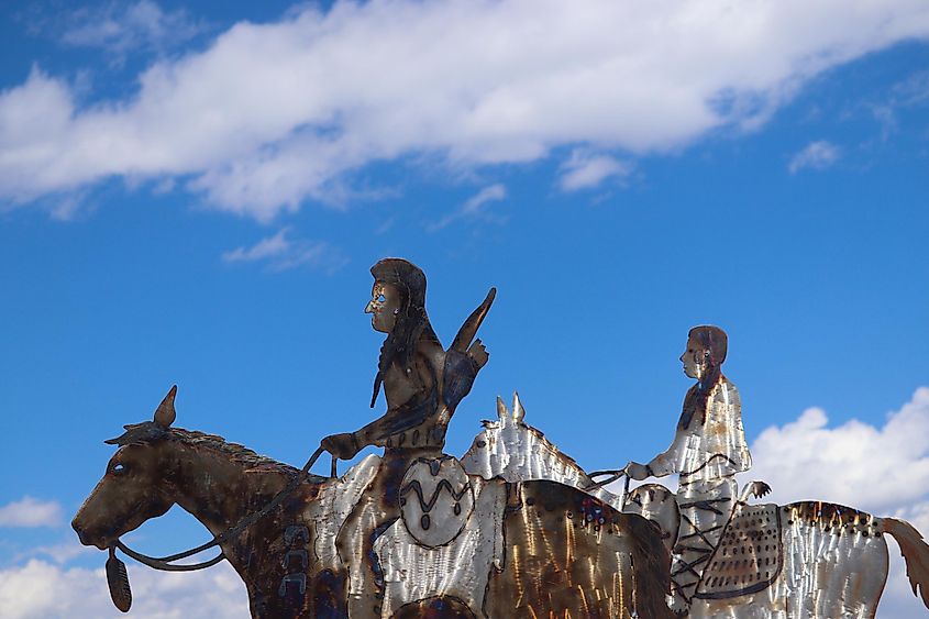 A metal sculpture of two Native American figures on horseback at Dead Indian Summit Overlook along Chief Joseph Scenic Highway.