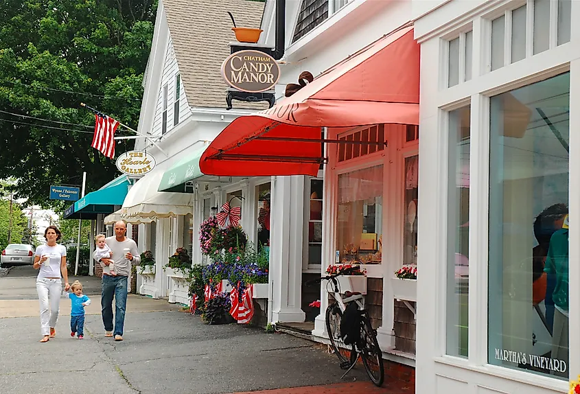 A young family walks through the Cape Cod town of Chatham, Massachusetts.