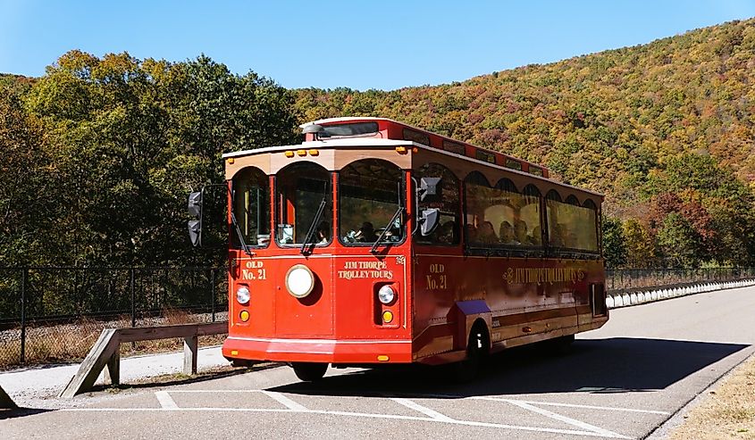 The bright red bus carrying passengers on the Jim Thorpe Trolley Tours, Pennsylvania.
