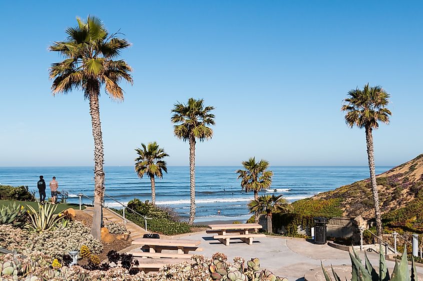 People enjoy a view of the ocean at scenic Fletcher Cove Beach Park in Solana Beach, California.