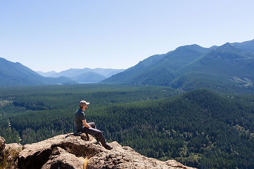 A young man enjoying a beautiful view of the Cascade Range