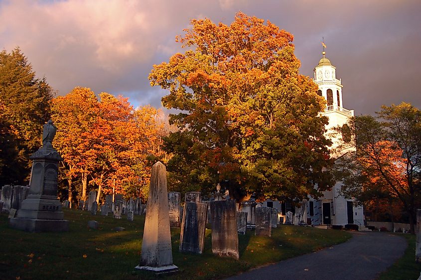Fall colors surround a cemetery and small church in Lenox, Massachusetts