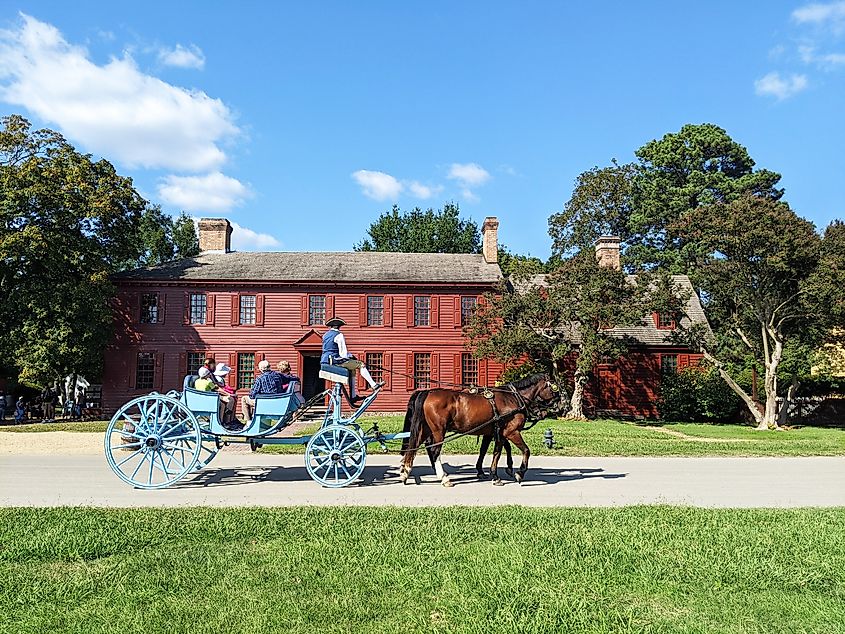 A horse carriage with tourists in Wiliamsburg, Virginia.