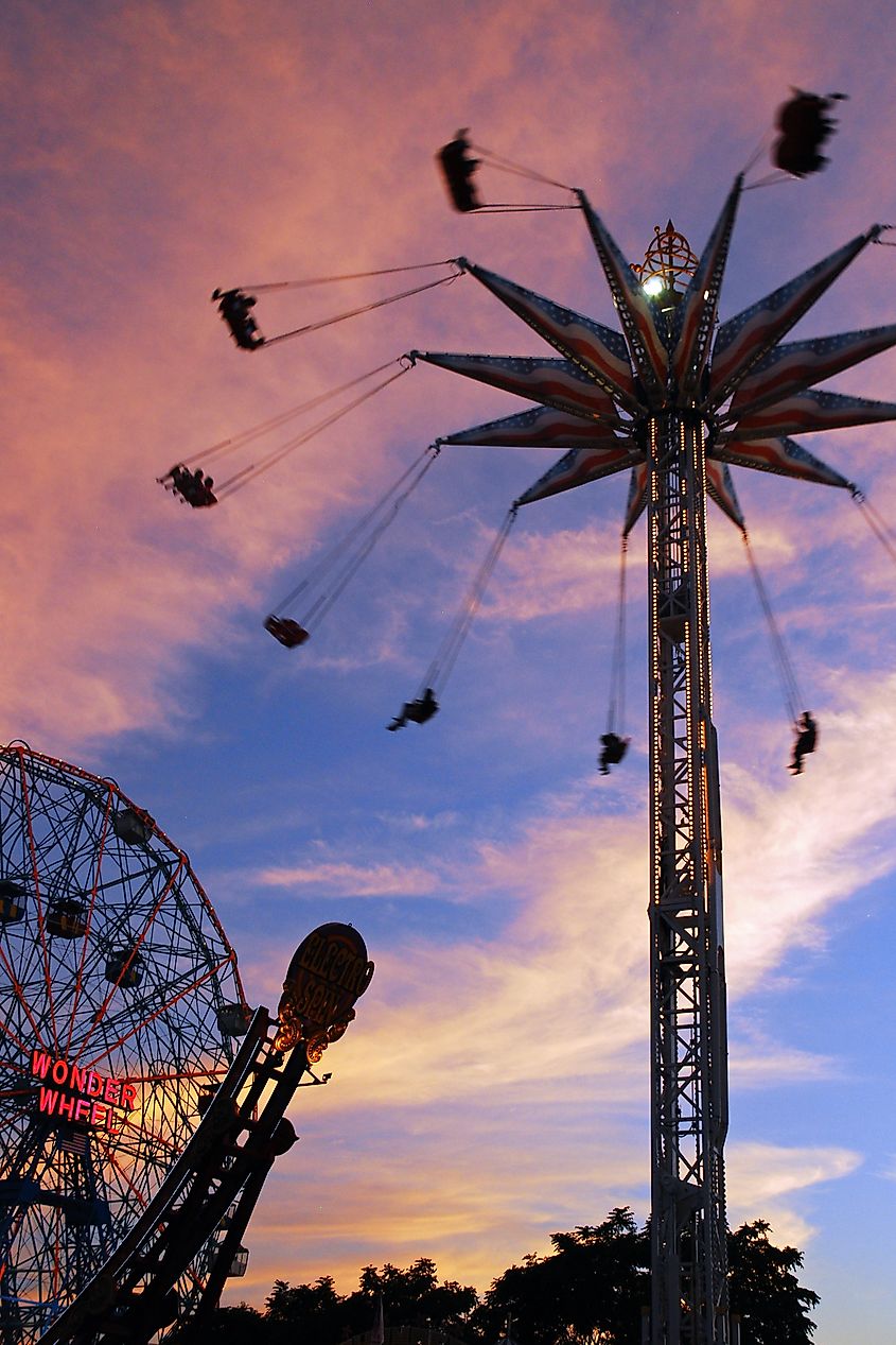 The Ferris wheel and other rides of the Coney Island Boardwalk amusements. Editorial credit: James Kirkikis / Shutterstock.com