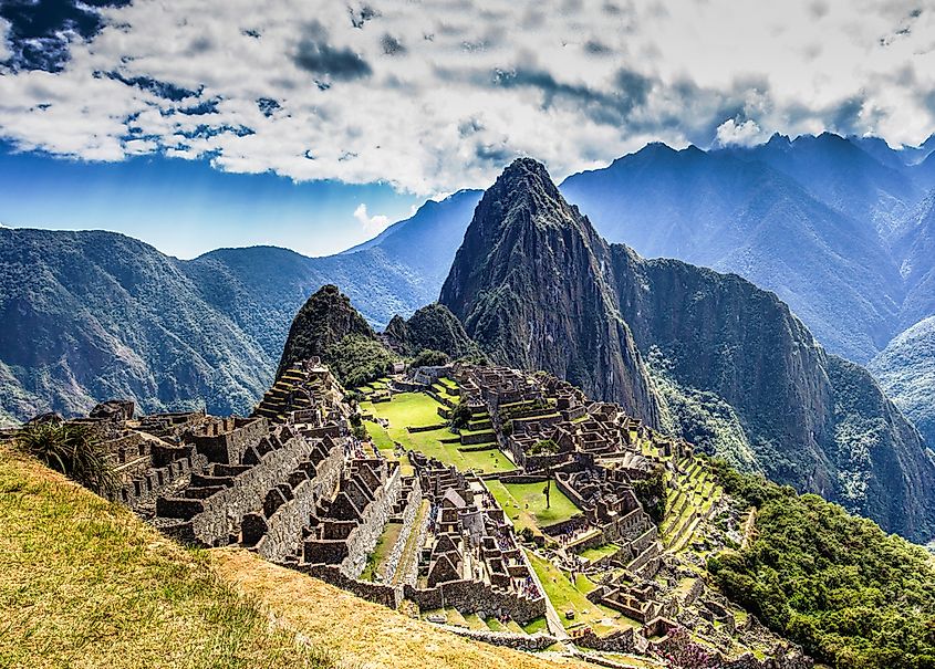 The Inca citadel of Machu Picchu on a mountain ridge above the Urubamba Valley, Peru.