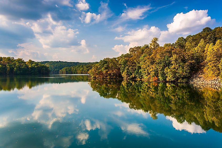 Clouds and trees reflecting in Prettyboy Reservoir, Baltimore County, Maryland