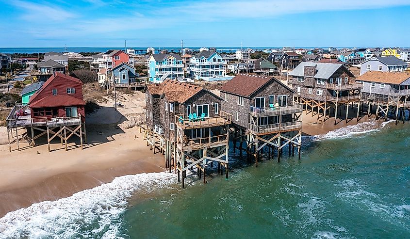 Aerial View of Beach Homes in Rodanthe North Carolina With Pilings in the Water at High Tide on a Sunny Day