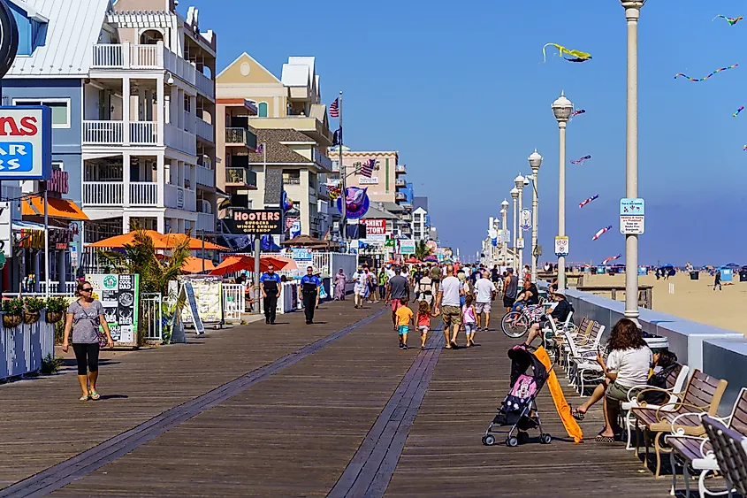 People walk on the Ocean City Boardwalk in Ocean City, Maryland