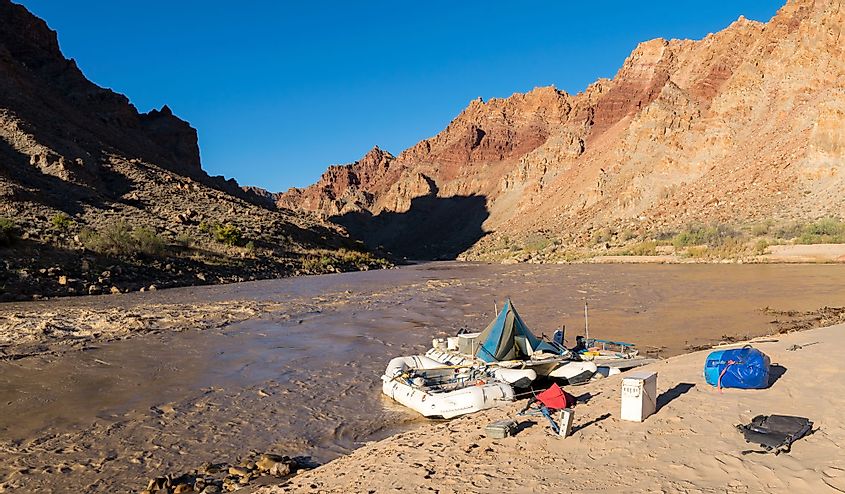A River raft waits for passengers on the Colorado River just above the entrance to Cataract Canyon in Canyonlands National Park. 