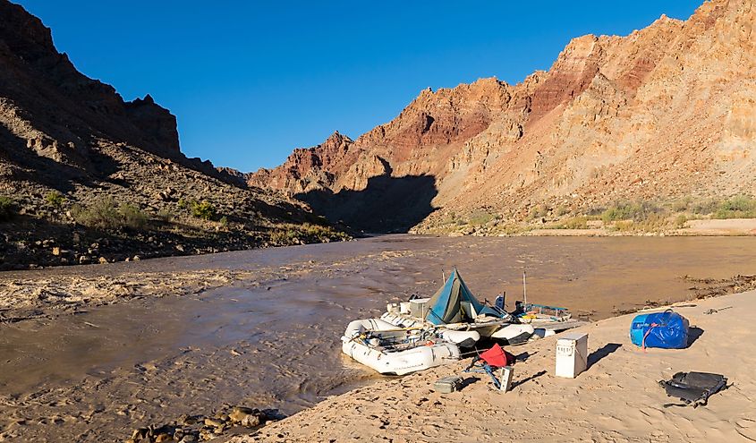 A River raft waits for passengers on the Colorado River just above the entrance to Cataract Canyon in Canyonlands National Park. 