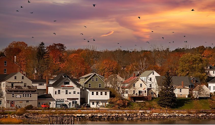 Waterfront homes and businesses in Wiscasset, Maine, at sunset.