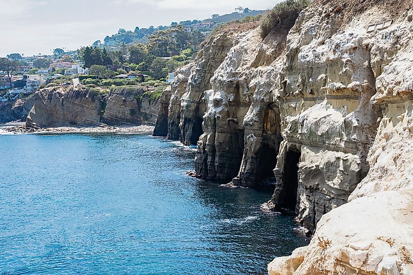 La Jolla sea caves with cliffside erosion and Sedimentary rock layers.