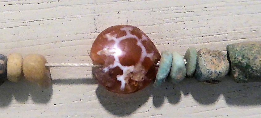 Characteristic Indian etched carnelian bead, found in Ptolemaic Period excavations at Saft el Henna, Ptolemaic Egypt. Petrie Museum, London
