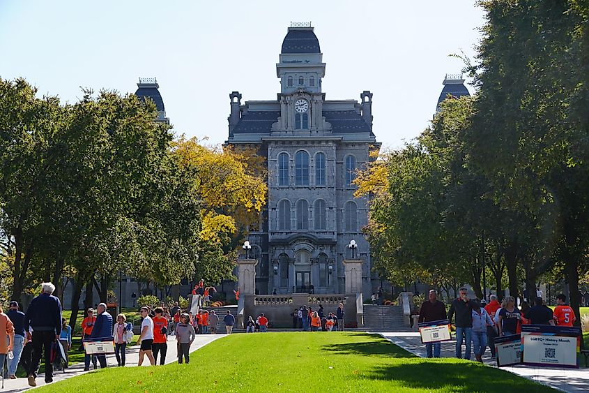 Syracuse, New York, U.S.A - October 15, 2022 - The college students and visitors walking around campus in the Fall near the Hall of Languages, via Khairil Azhar Junos / Shutterstock.com