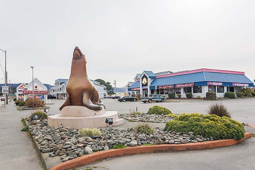 Crescent City, CA, USA - February 8th, 2021: Street view near the Ocean World Aquarium. Sea lions figure on foreground, via Victoria Ditkovsky / Shutterstock.com