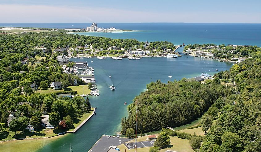 Aerial view of Round Lake in Charlevoix, Michigan, early summer, with boat traffic.