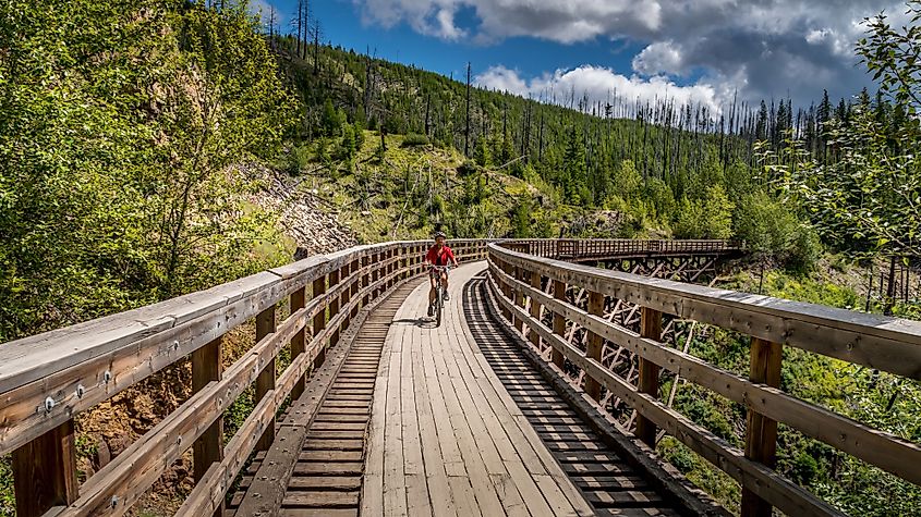 Biking over an old wooden bridge in Myra Canyon near Kelowna