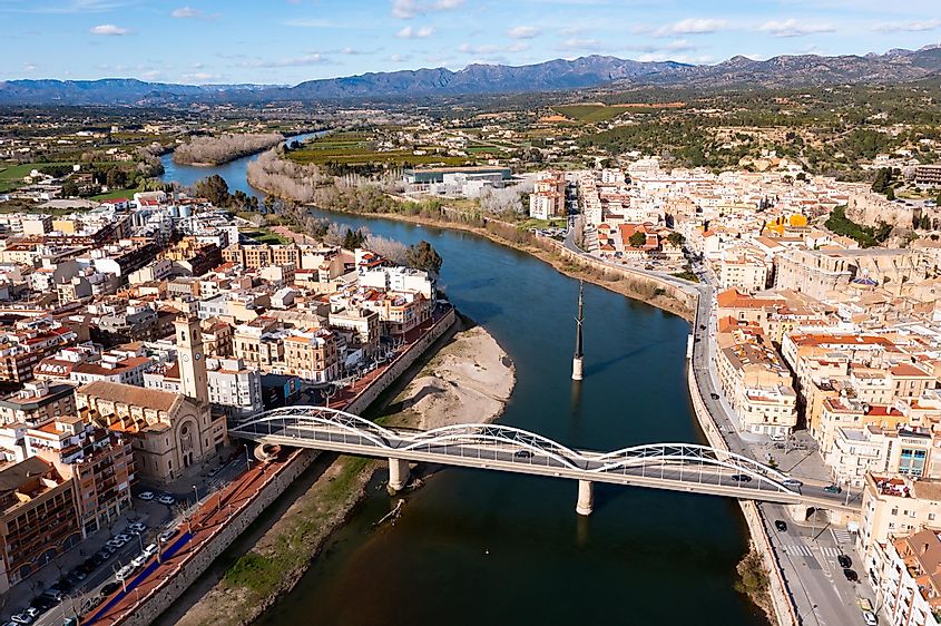 Ebro River flowing through the city of Tortosa in Spain.