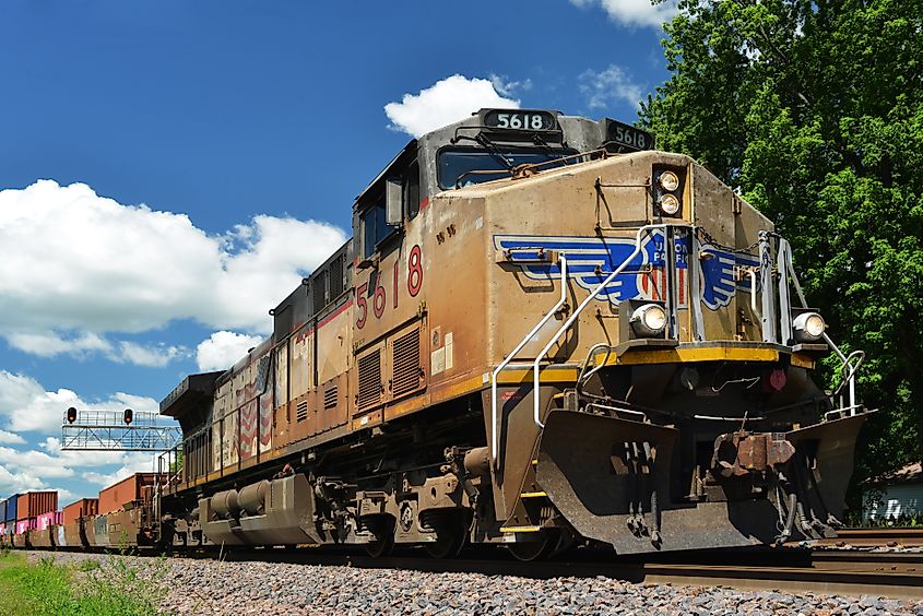 The Union Pacific diesel locomotive pulling a freight train of container cars in Rochelle, Illinois.
