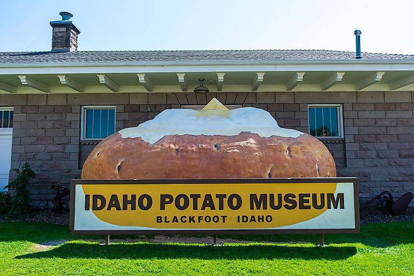 Idaho Potato Museum sign and giant baked potato at a museum devoted to the potato history and industry. - Blackfoot, Idaho