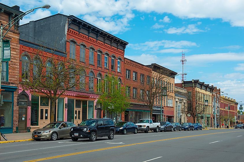 Historic sandstone and brick commercial buildings at Main Street in downtown Potsdam, Upstate New York.