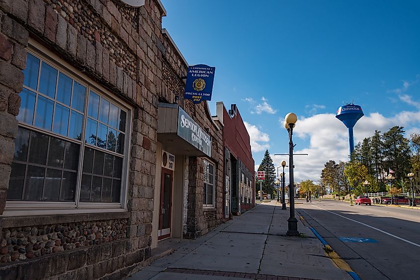 Lake Street in downtown Chisholm, Minnesota, with the City of Chisholm water tower in the distance.