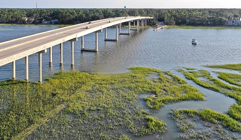 Aerial drone view over the bridge on the cross island parkway with marshland below