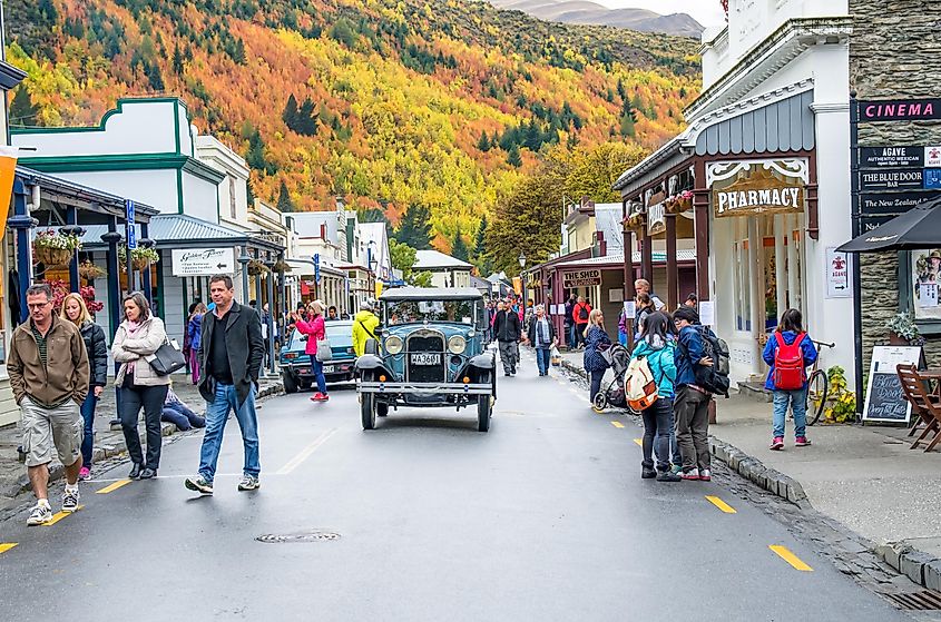People can seen exploring around the Arrowtown during the Arrowtown Autumn Festival on Buckingham Street