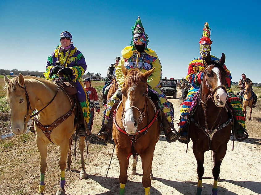 Three Cajun Mardi Gras horseback riders in Eunice, Louisiana. Editorial credit: Elliott Cowand Jr / Shutterstock.com