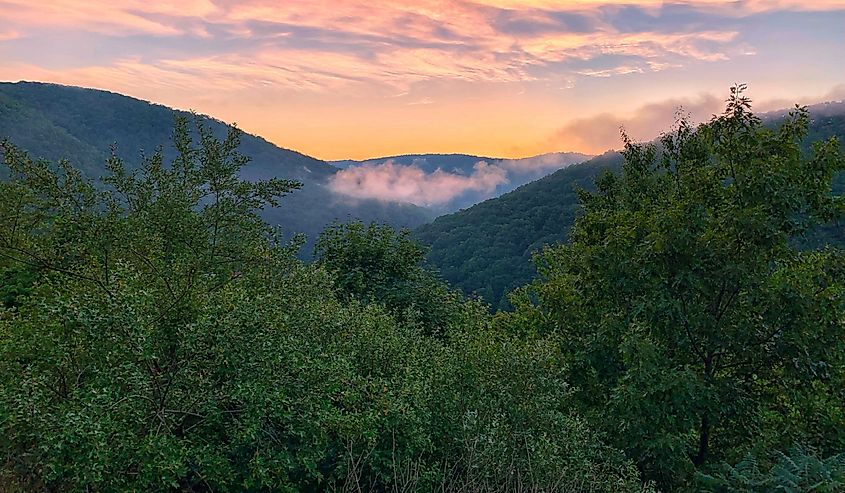 A colorful sunset sky above the cool, cloudy Pocono Mountains in Pennsylvania