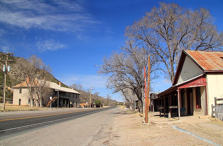 The main street through Lincoln, New Mexico, passes in front of numerous old structures.