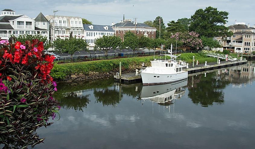 Downtown Lewes, Delaware with a boat in the canal.