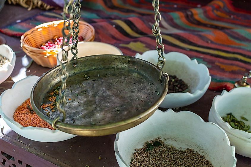 Ancient bronze scales weighing colourful spices