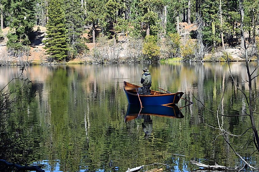 Fisherman in Dory at Manzanita Lake, Lassen National Park, California