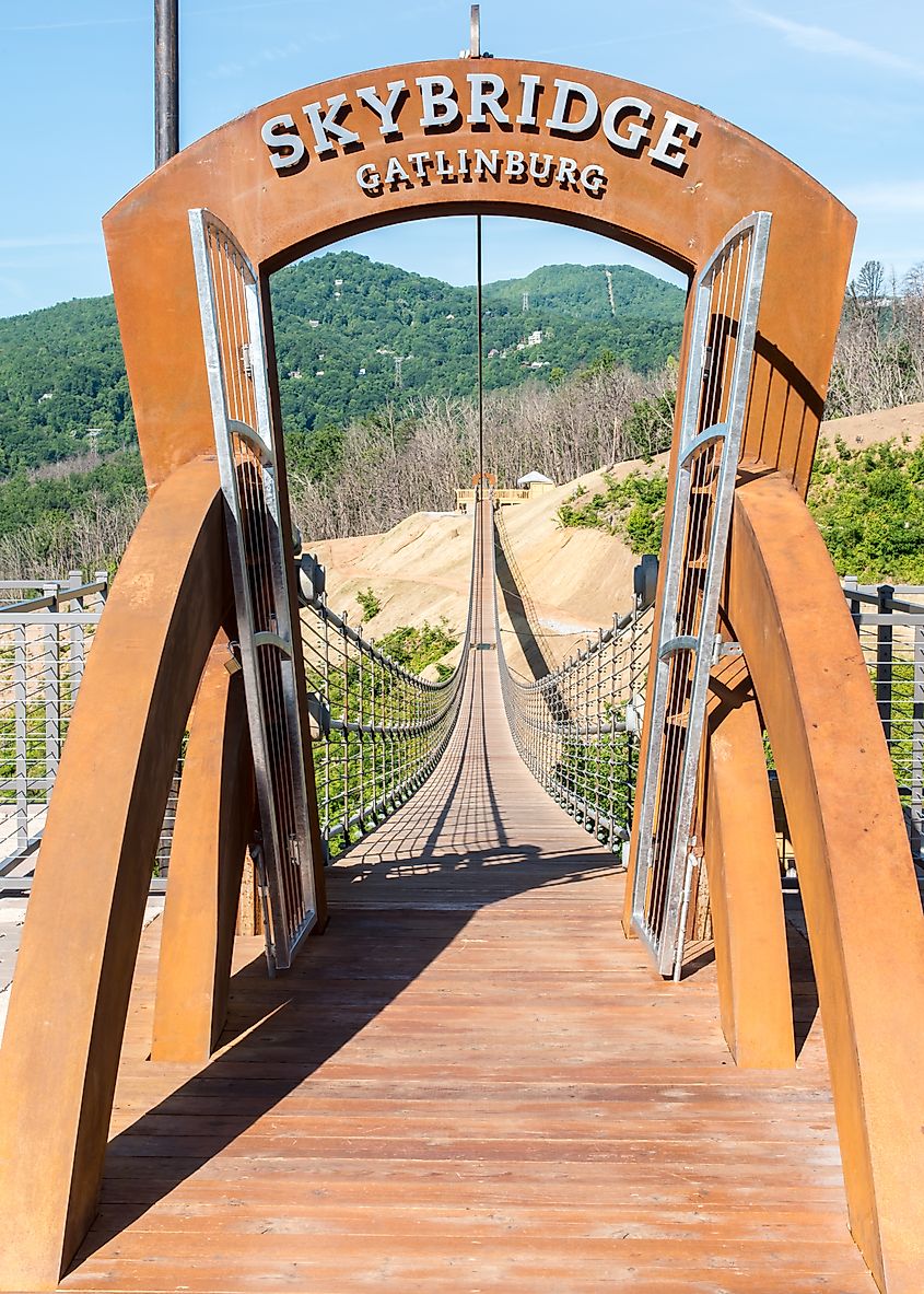 Entrance to Skybridge suspension bridge with a view of the Smoky Mountains in background. Editorial credit: Steve Lagreca / Shutterstock.com