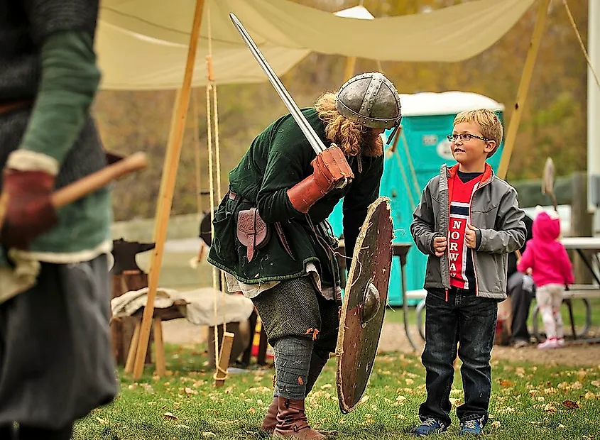 A Viking reenactor chooses a young boy to be his Jarl during Norsk Høstfest Military Appreciation Day in Minot, N.D.
