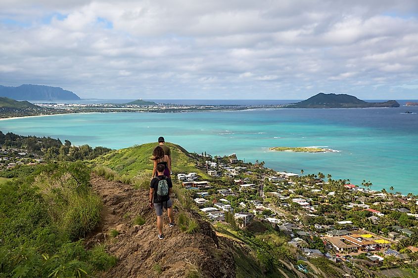 Hikers with the view of Lanikai from the top of the Pillbox hiking trail, Kailua, Hawaii