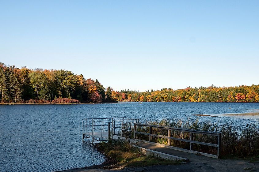 Autumn trees beside the water at Promised Land State Park, Pennsylvania.